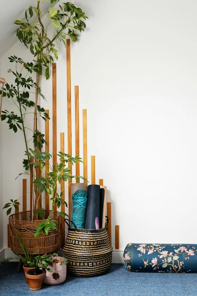 A corner of a room with a soft floor covering and nothing rigid standing on it